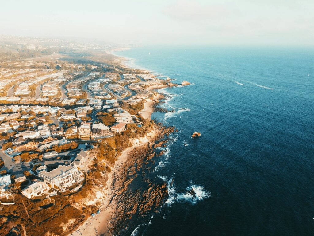 aerial view of city near body of water during daytime